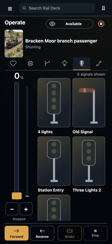 Colour-light and semaphore signal tiles beside the selected train’s throttle and direction controls.